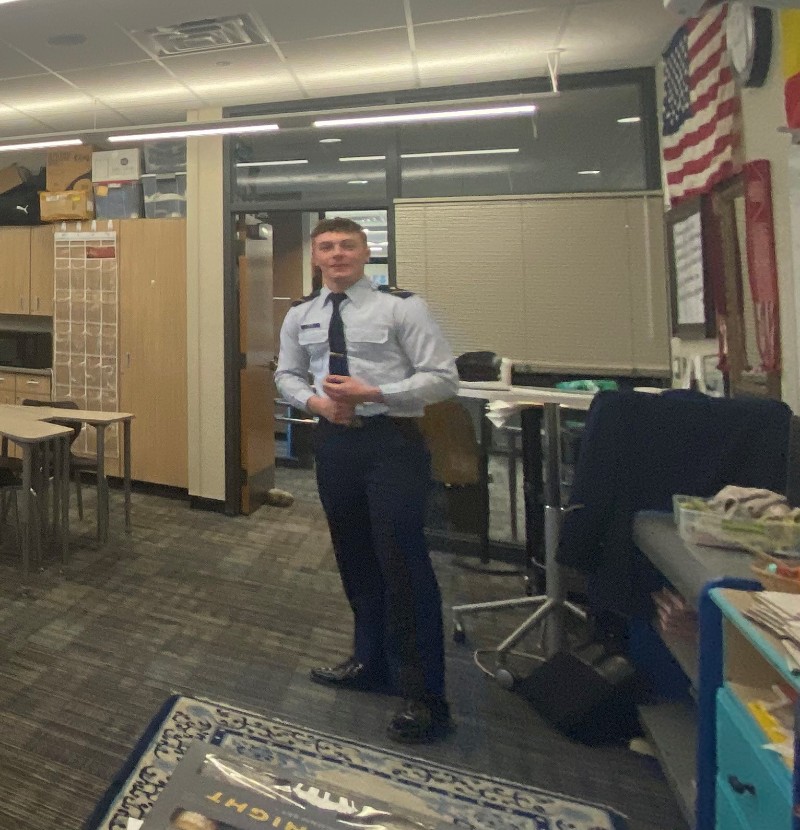 Coast Guard Academy Cadet giving a presentation in a classroom